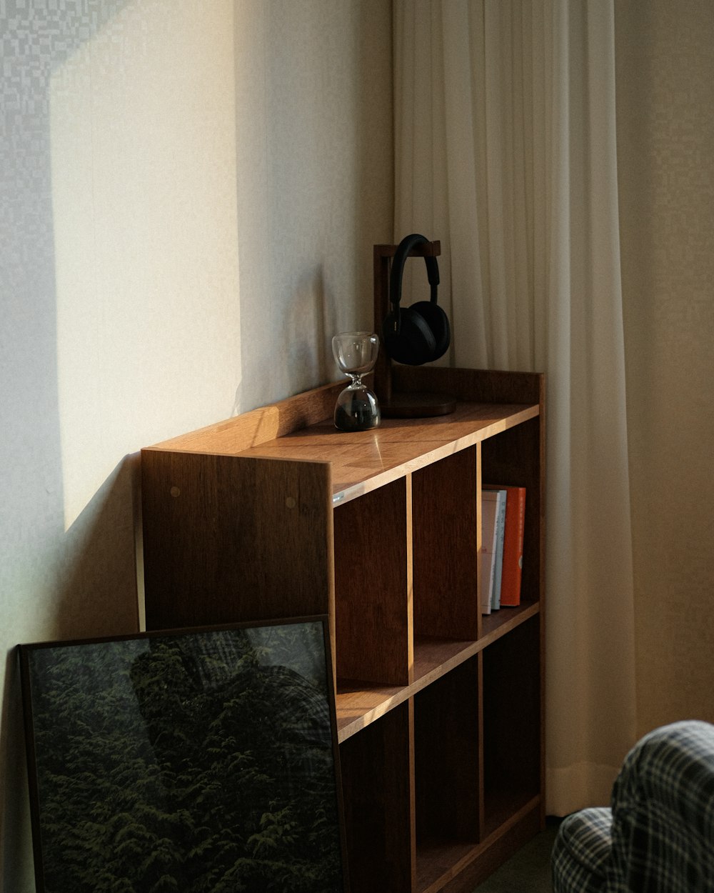 a room with a book shelf and a television