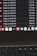 A computer screen displays a list of files with details such as timestamps, file sizes, and formats in a dark-themed interface. The bottom part of the screen shows various application icons on a MacOS dock, including familiar apps like VLC, WhatsApp, and Apple Music. A keyboard is partially visible at the bottom.