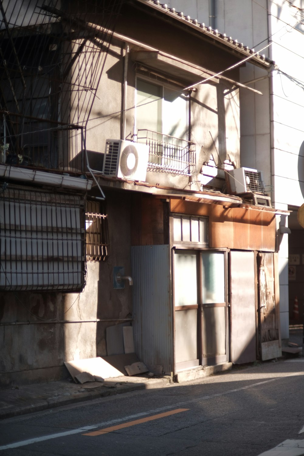 a street corner with a building and a street sign