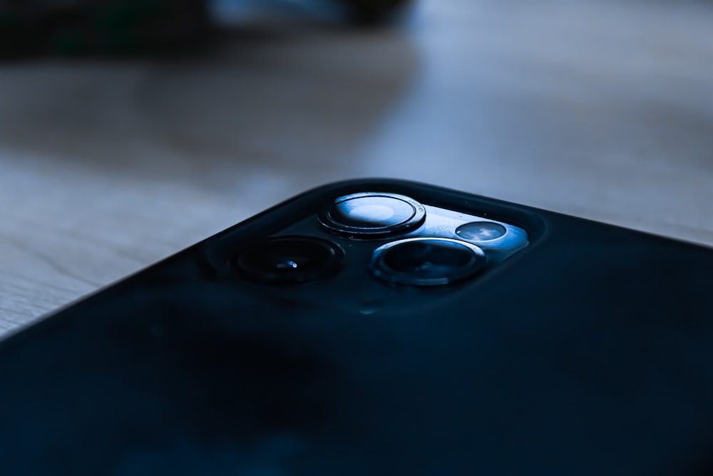 a close up of a cell phone on a table