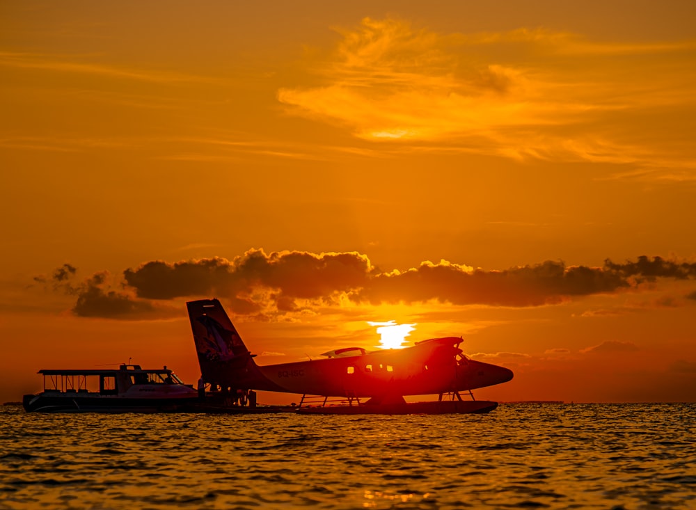 a plane sitting on top of a body of water