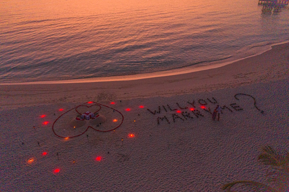 a message written in the sand on a beach