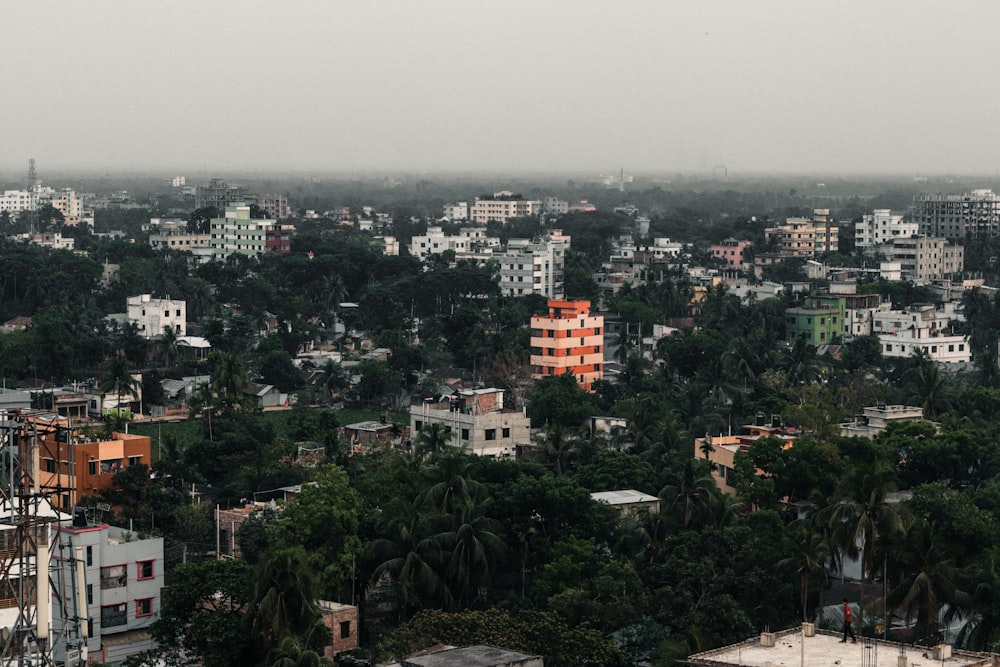 a city with lots of tall buildings and trees