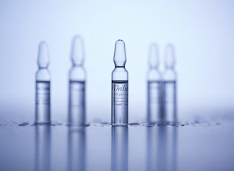 a group of small bottles sitting on top of a table