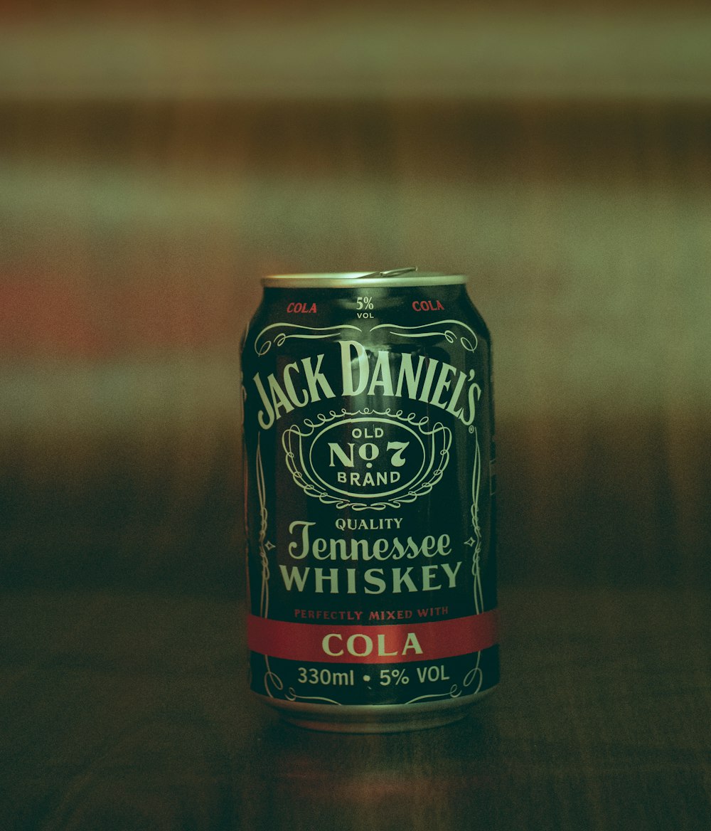 a can of jack daniels on a wooden table