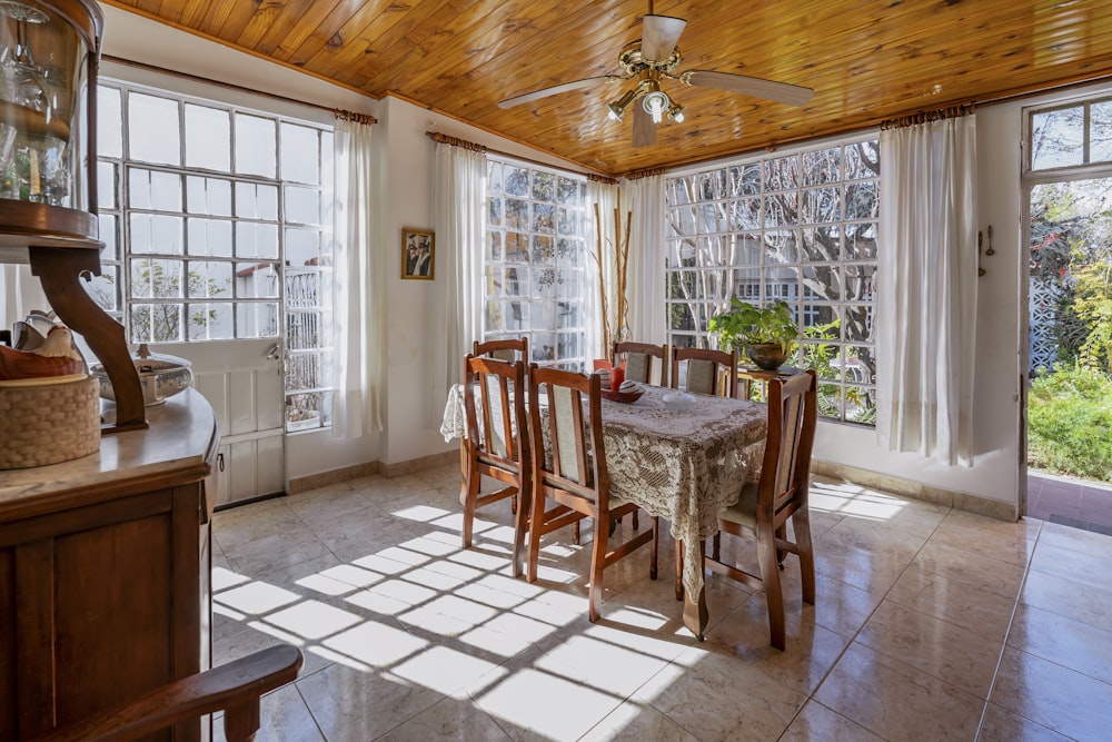 a dining room with a table and chairs