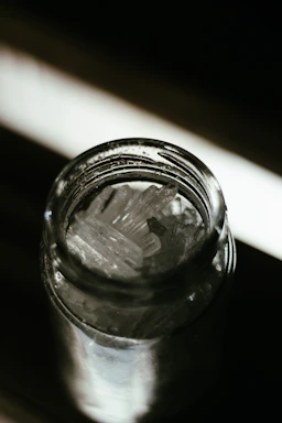 A vibrant close-up of Don Cucos seasoning jars with Baja Gold salt crystals sparkling under warm light.