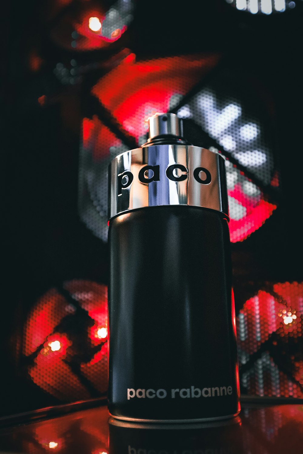 a close up of a bottle of perfume on a table