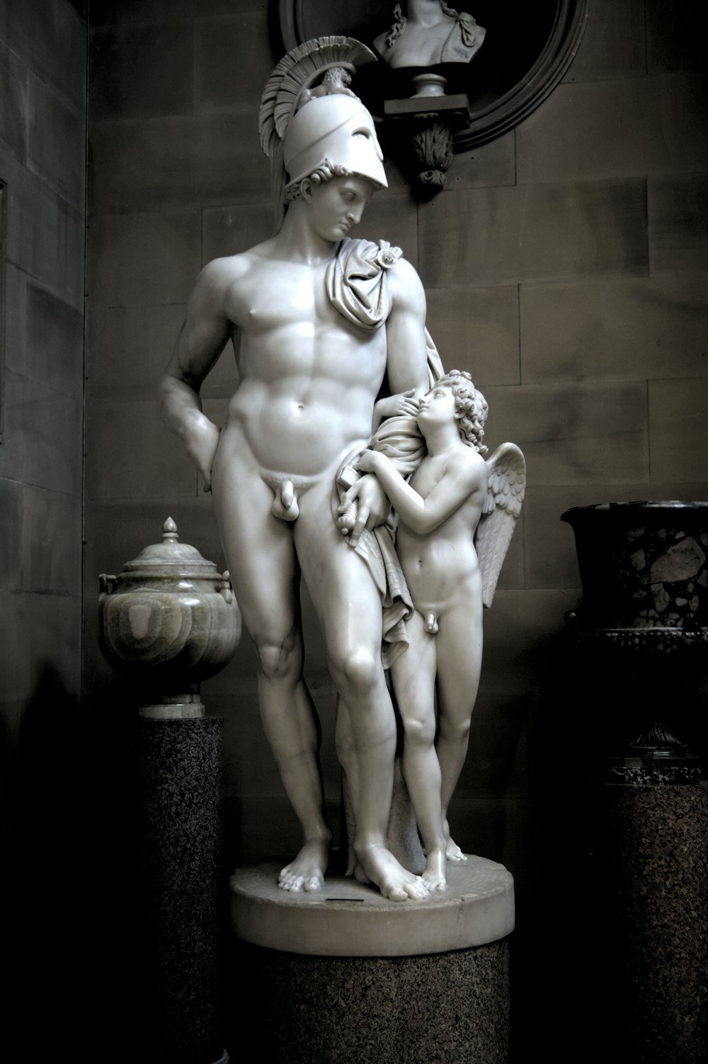 a statue of a man holding a child