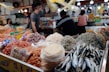 A vibrant display of assorted dried seafood products laid out in baskets highlighting variety and quality.
