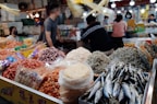 A vibrant display of assorted dried seafood products laid out in baskets highlighting variety and quality.