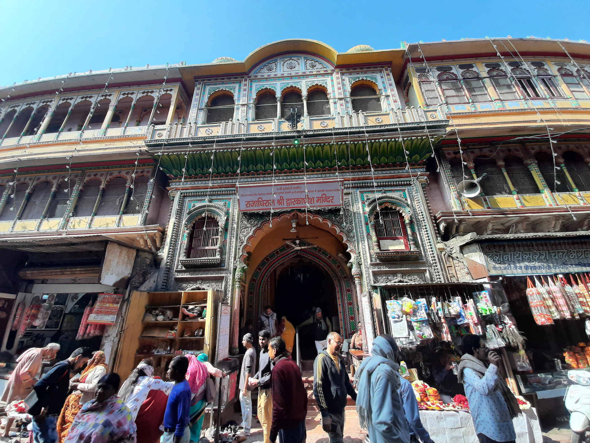 A colorful street scene from Ahmedabad's old city, showcasing bustling markets and traditional architecture.