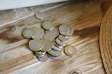 An assortment of collectible coins and models showcased on a rustic table.