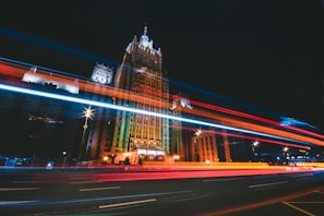 A sleek V16 beacon glowing brightly on a dark roadside at night
