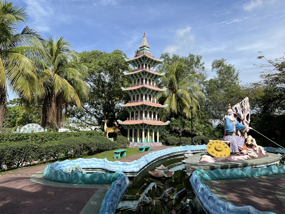 a fountain with a statue of a man on top of it