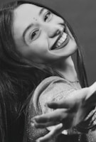 A vibrant portrait of a disabled African artist smiling confidently in their studio.