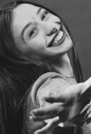 A vibrant portrait of a disabled African artist smiling confidently in their studio.