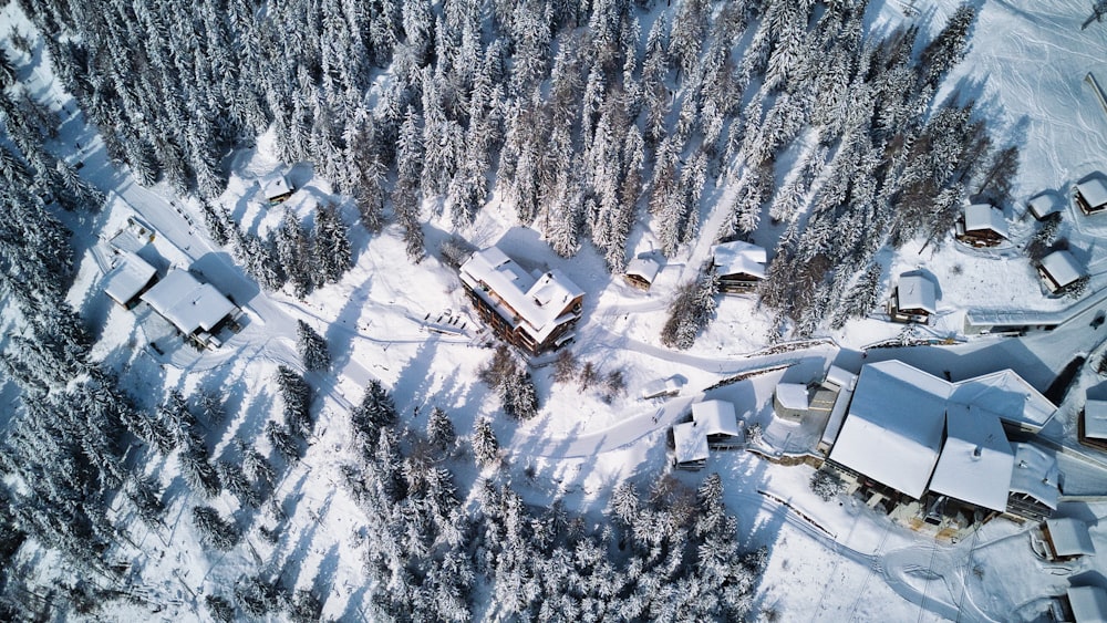 an aerial view of a house in the snow