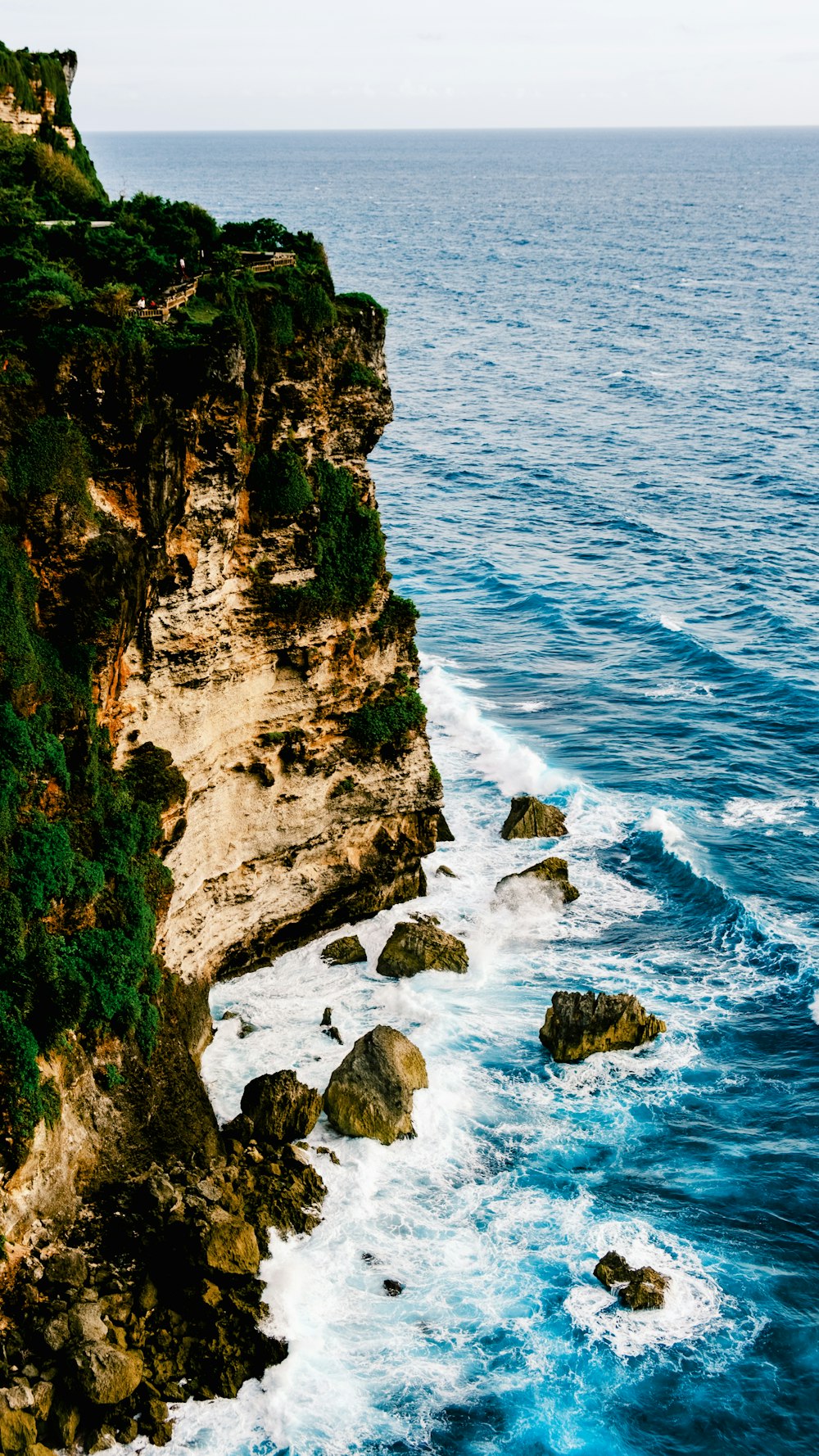 a view of the ocean from the top of a cliff