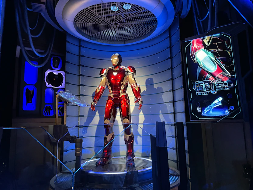 A sleek, futuristic spandex suit with intricate mechanical details glowing subtly against a deep black background.