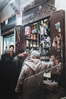 a group of people standing around a store
