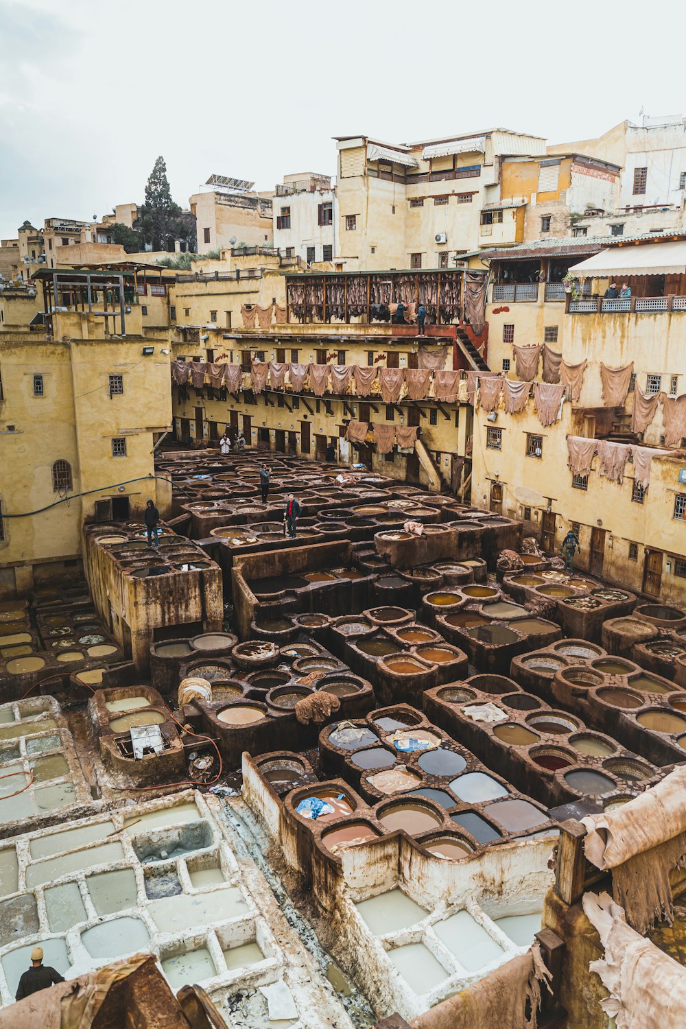 a group of old buildings with lots of windows