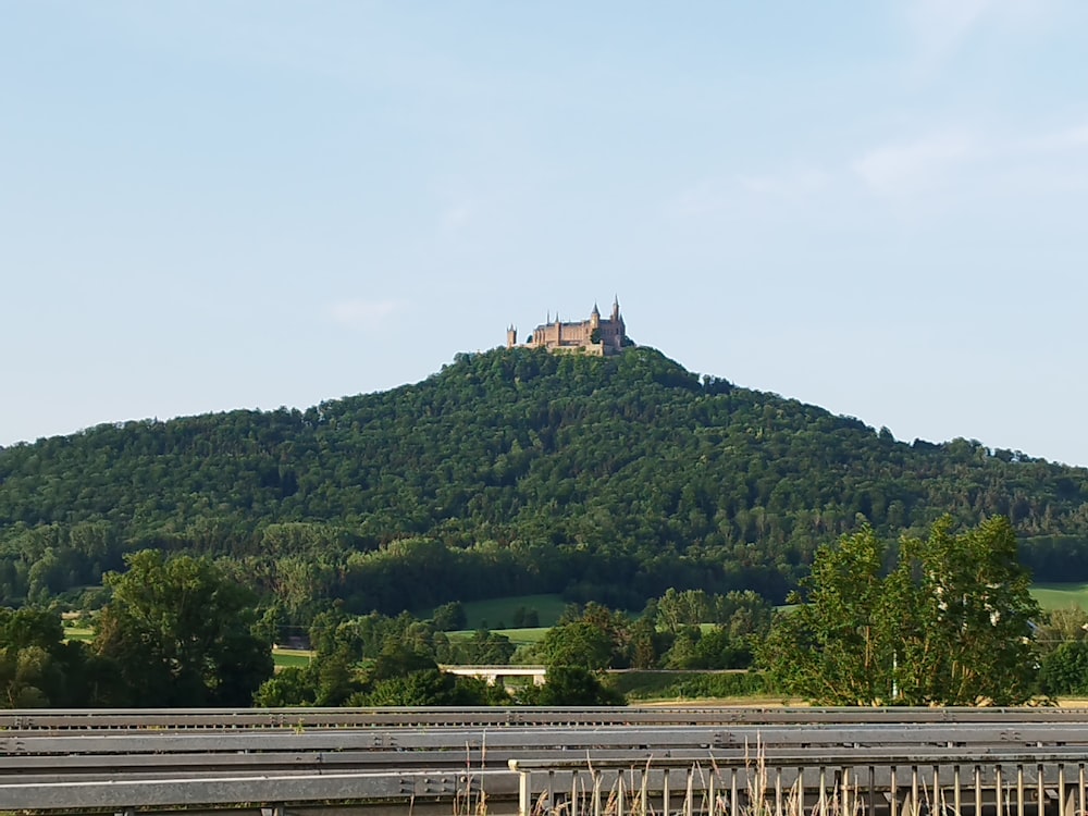 a large hill with a castle on top of it