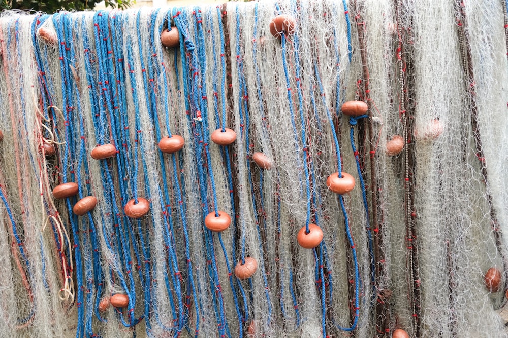 a wall with a bunch of different colored beads on it