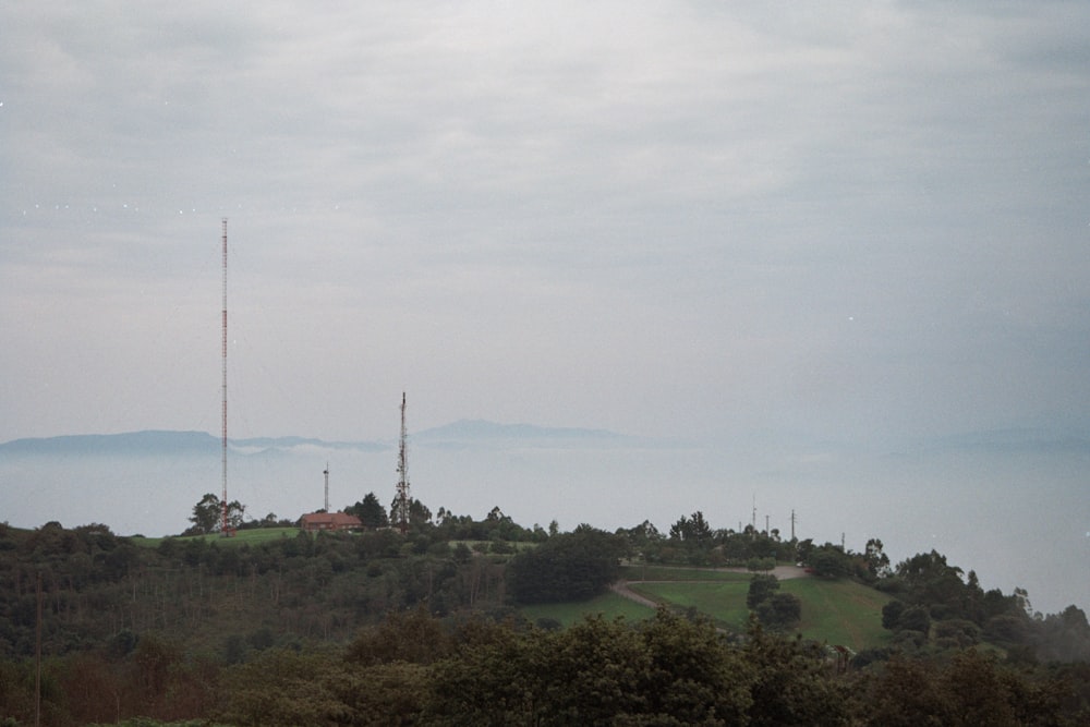 a view of a hill with a cell tower in the distance