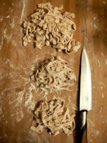 Handmade pasta being prepared in the kitchen with fresh ingredients.