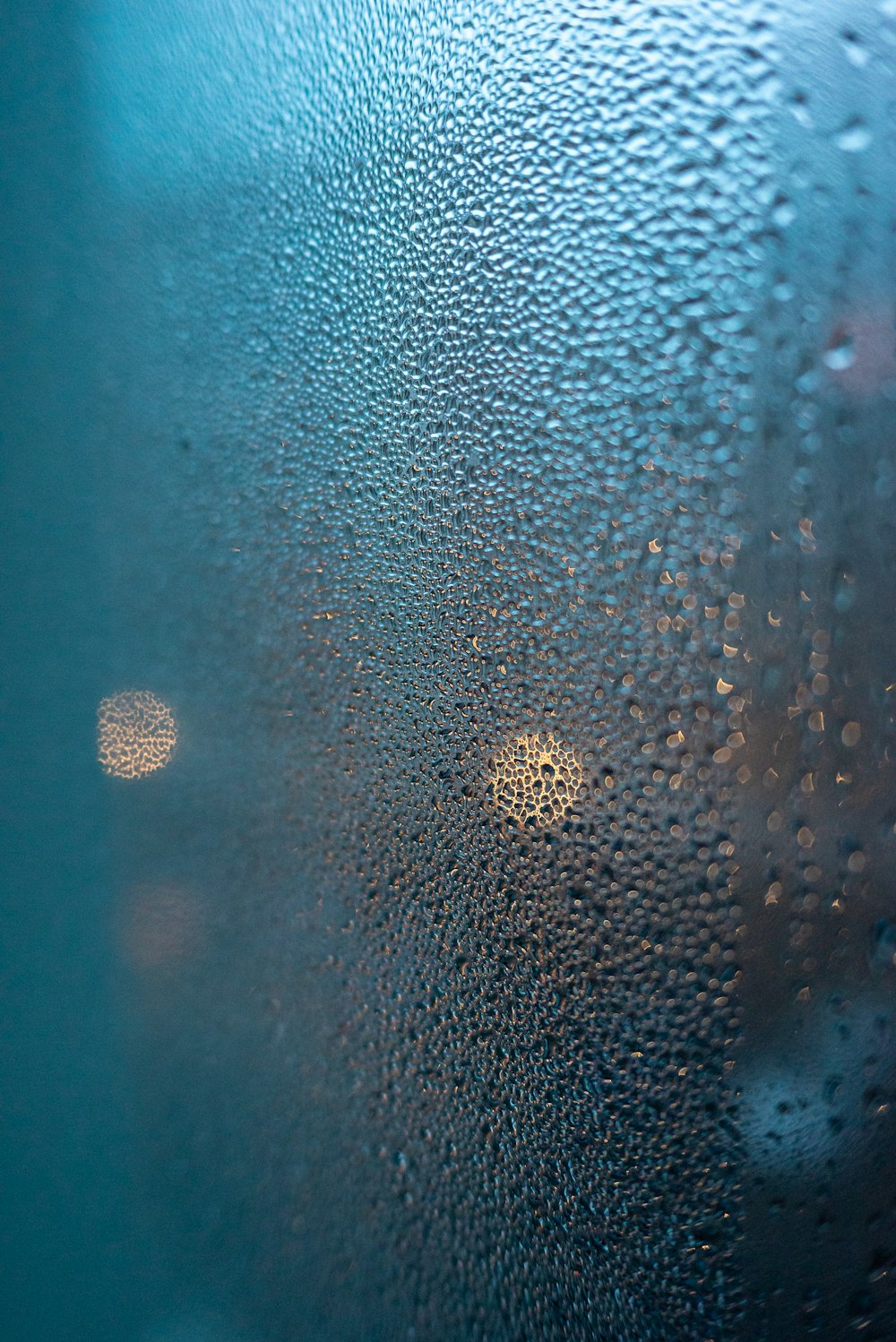 a close up of a window with rain drops