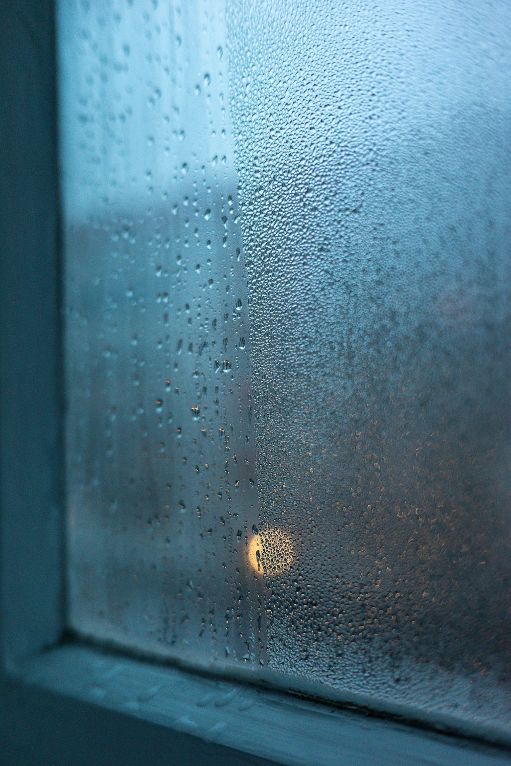 a close up of a window with rain drops