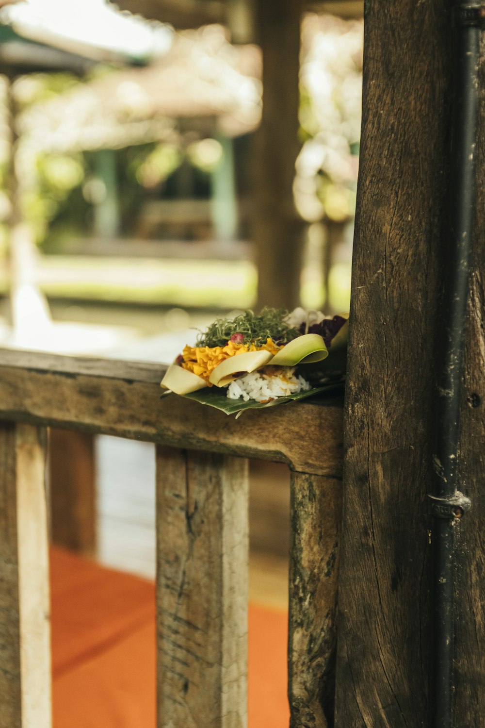 a plate of food sitting on top of a wooden table