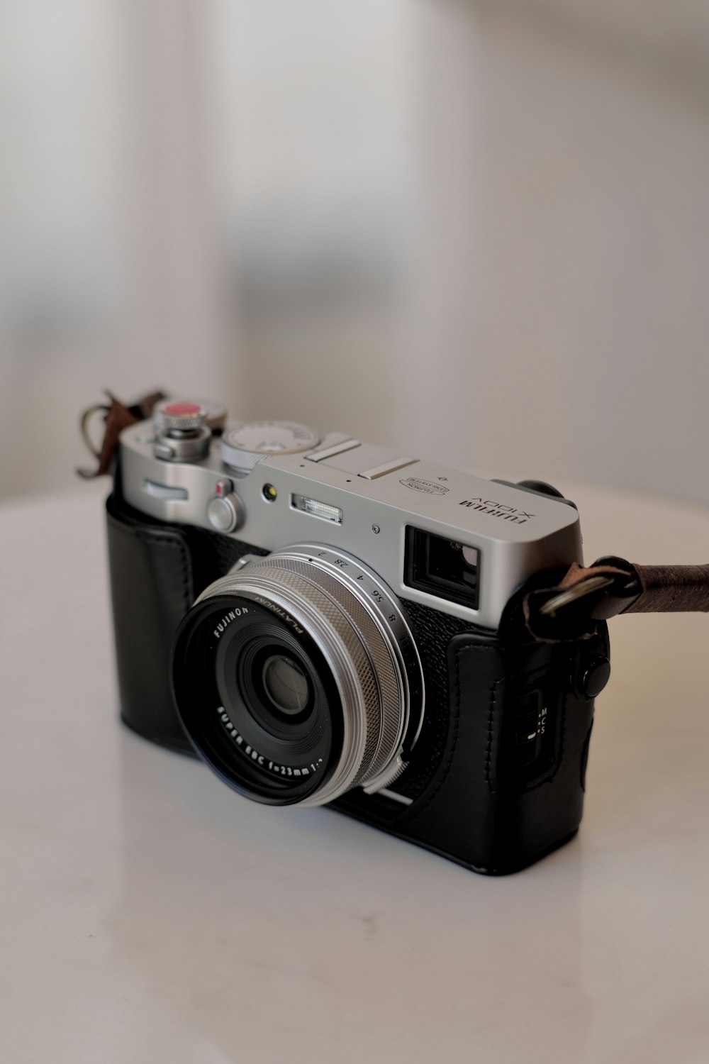 a camera sitting on top of a white table