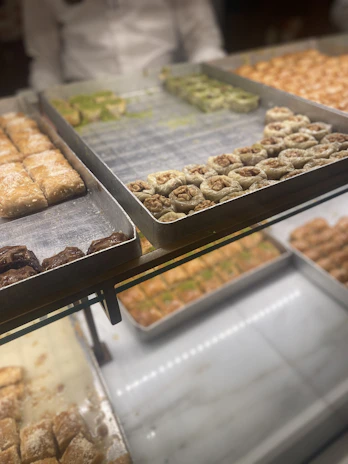 A colorful assortment of Nutriice protein desserts arranged on a rustic wooden table