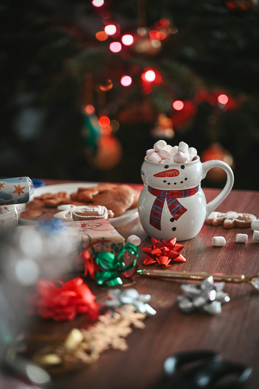 a cup of hot chocolate with marshmallows and a snowman mug