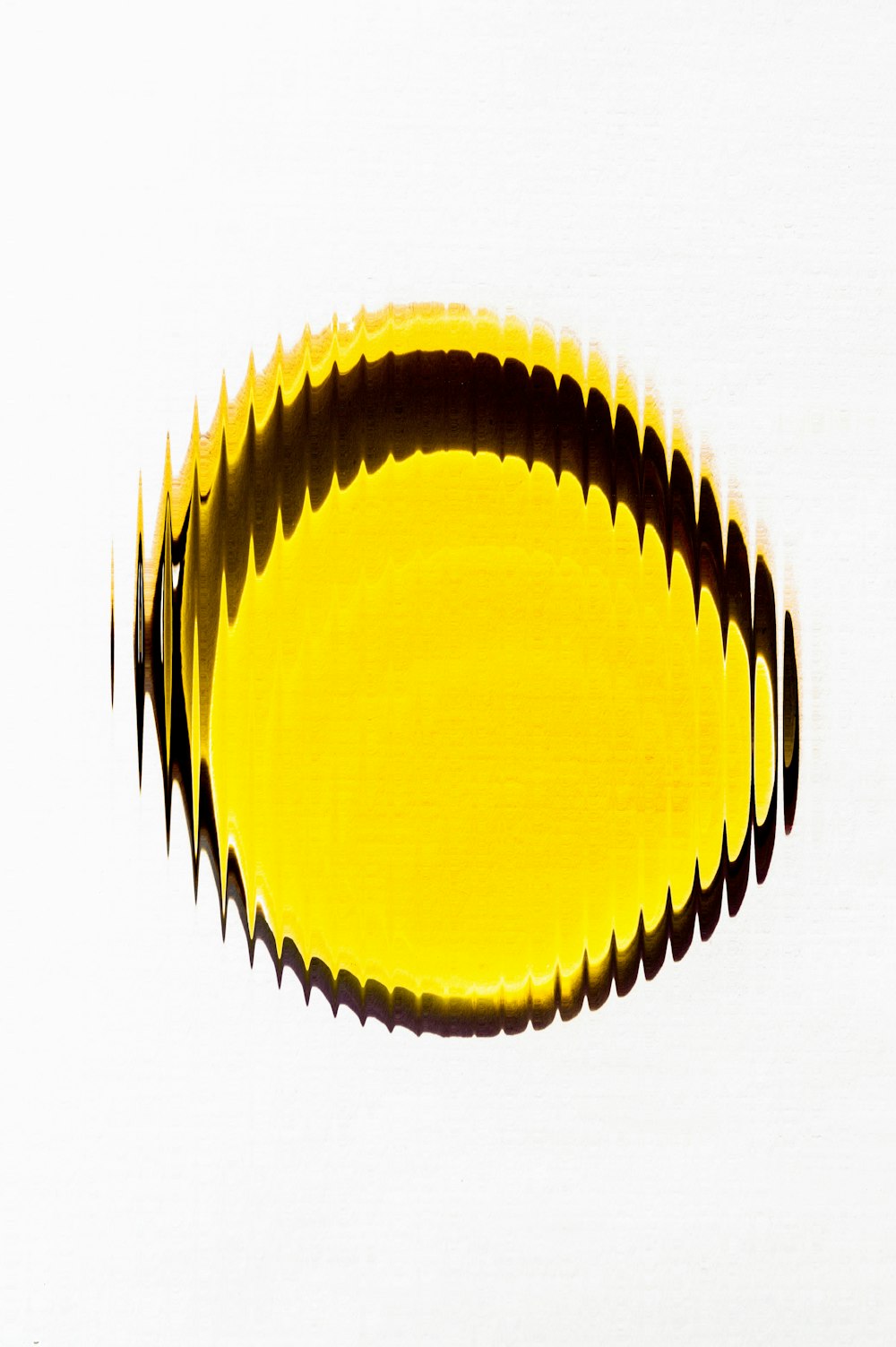 a close up of a yellow object on a white surface