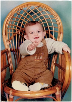 A happy baby comfortably seated in one of Librada LLC’s chairs.