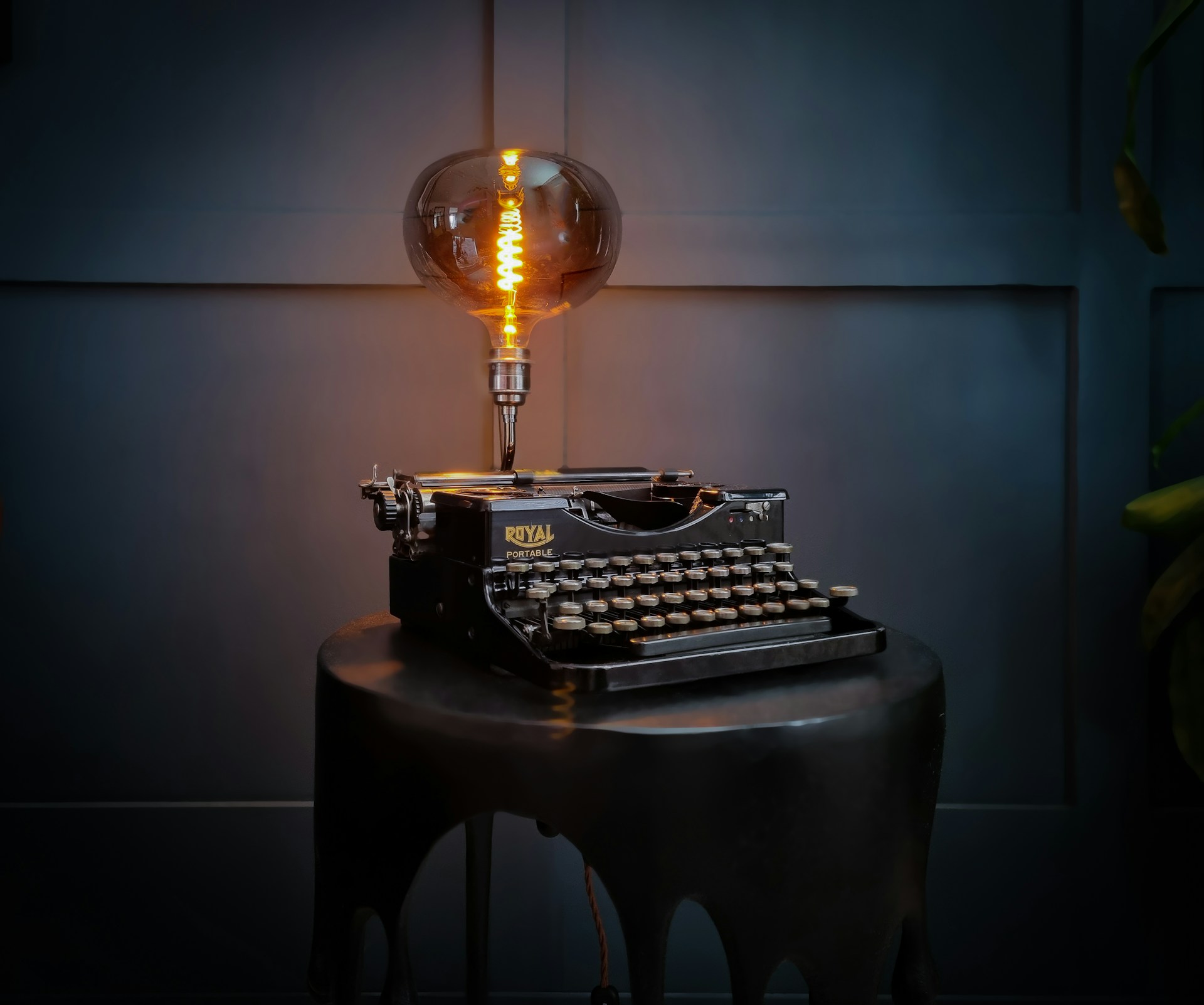 an old fashioned typewriter sitting on top of a table