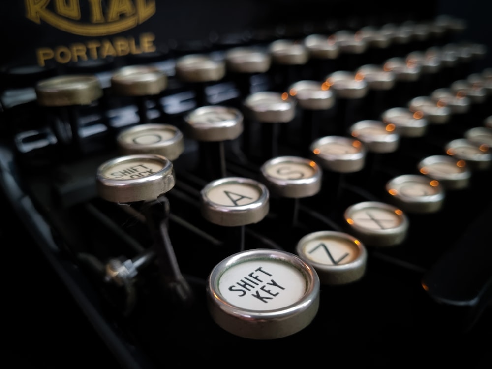 a close up of an old fashioned typewriter