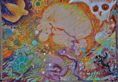A vibrant and abstract painting featuring various animals like an owl, bird, turtle, and possibly other creatures. The artwork includes swirling patterns and intricate details with a mixture of celestial and organic elements. Bright colors and dynamic movement give the image a lively and whimsical feel.