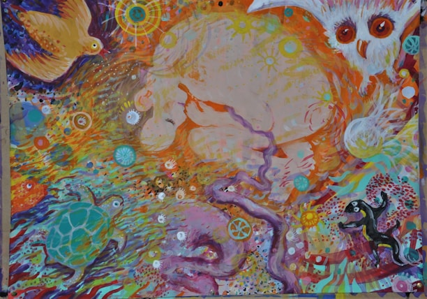 A vibrant and abstract painting featuring various animals like an owl, bird, turtle, and possibly other creatures. The artwork includes swirling patterns and intricate details with a mixture of celestial and organic elements. Bright colors and dynamic movement give the image a lively and whimsical feel.