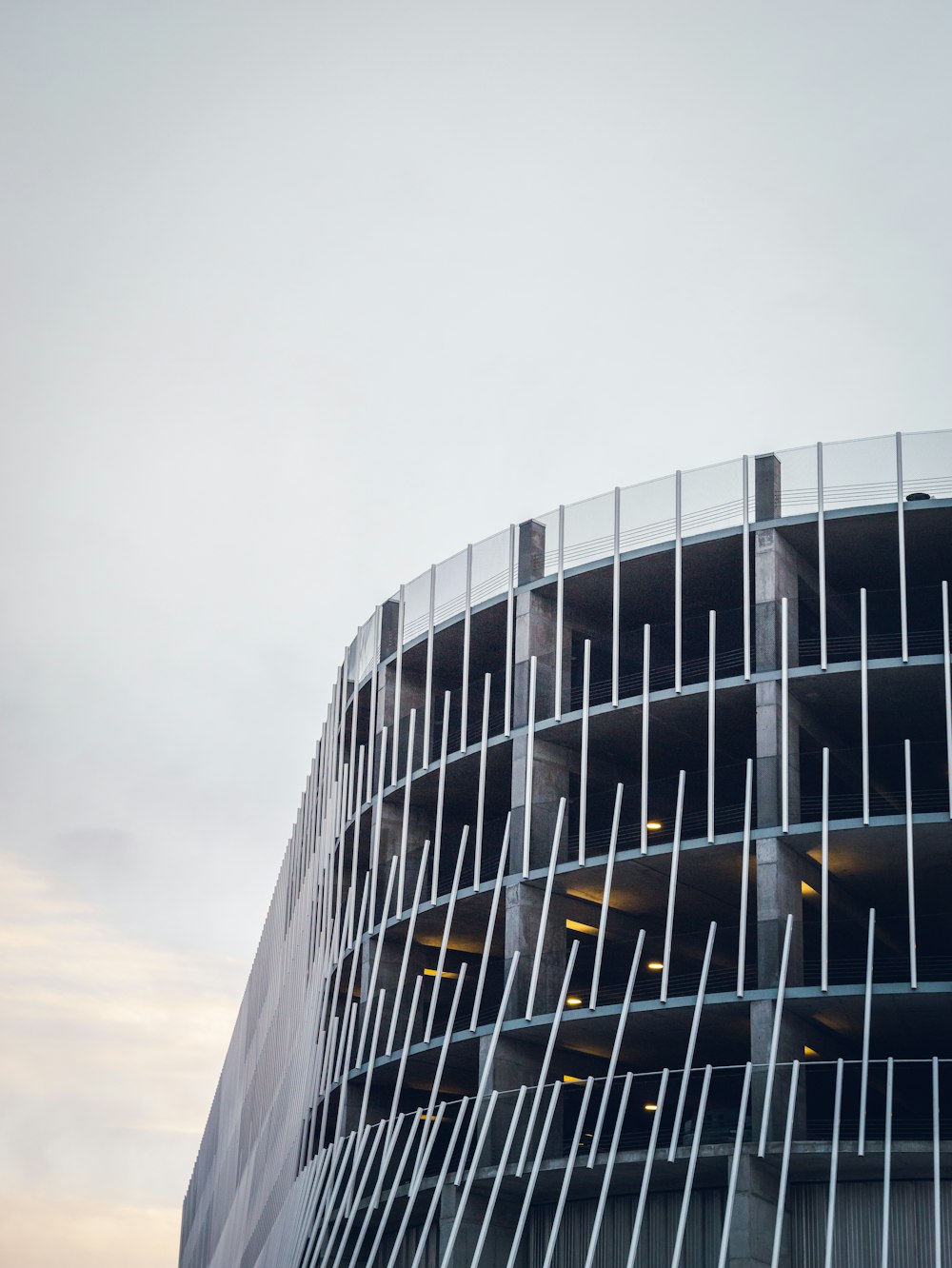 a tall building with a curved metal facade