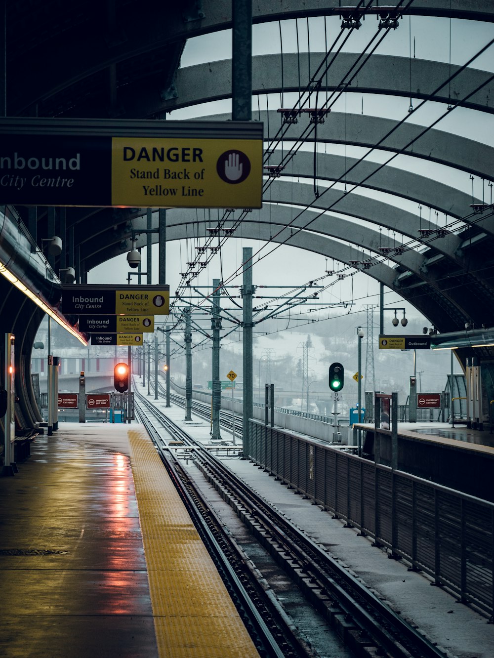 a train station with a train on the tracks