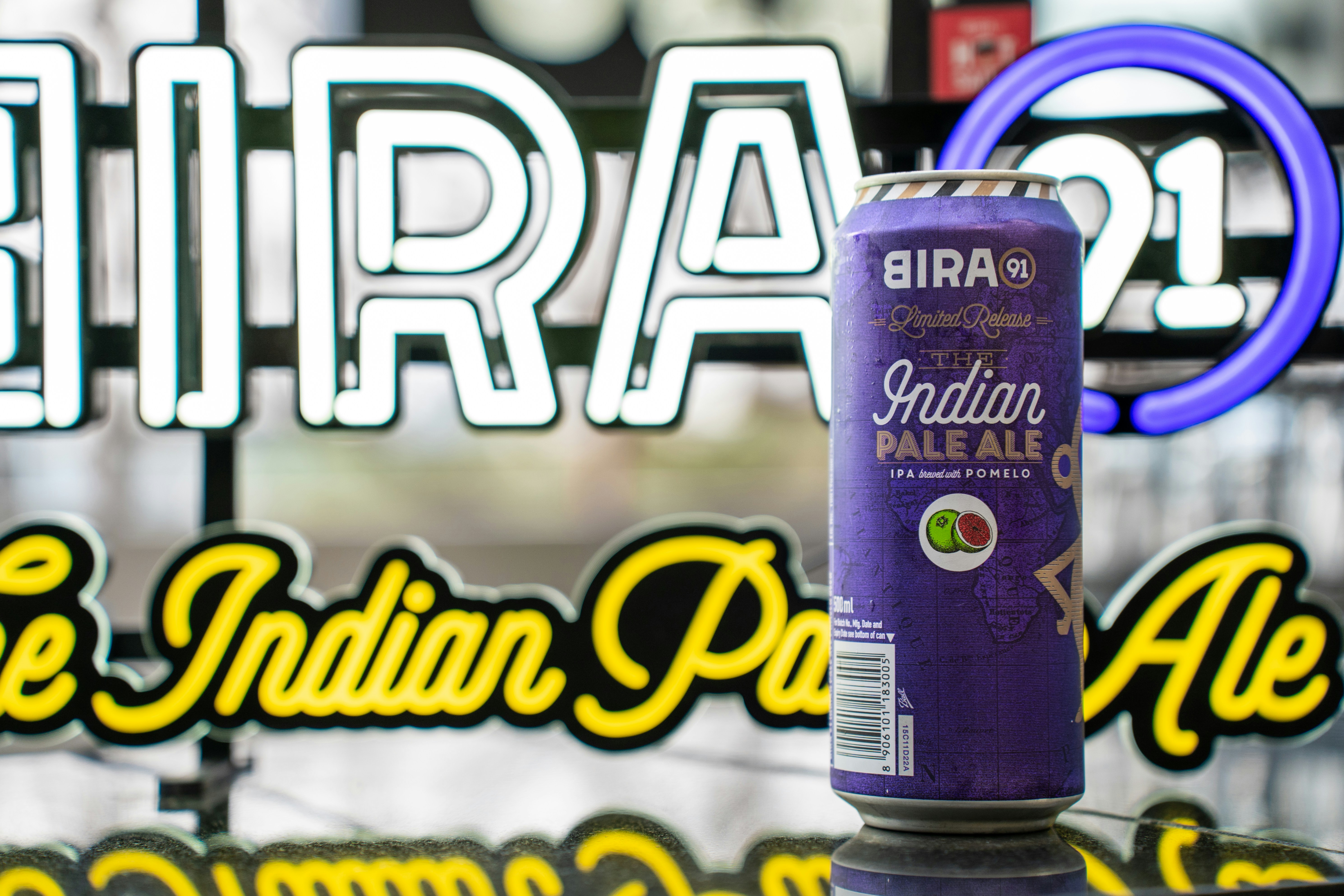 a can of beer sitting on top of a table