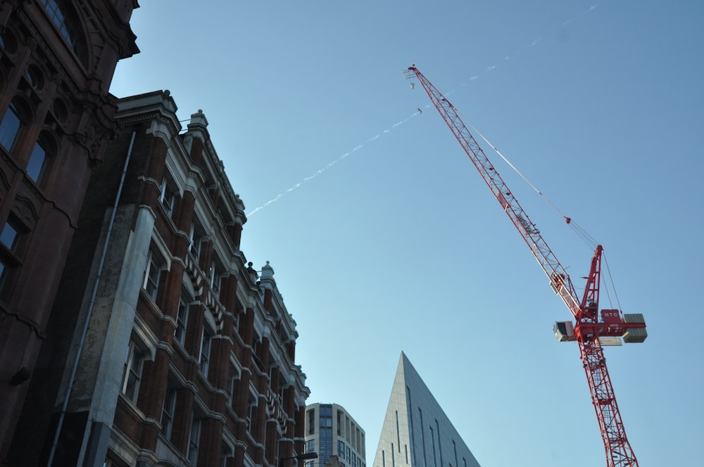 a crane is in the air above a building