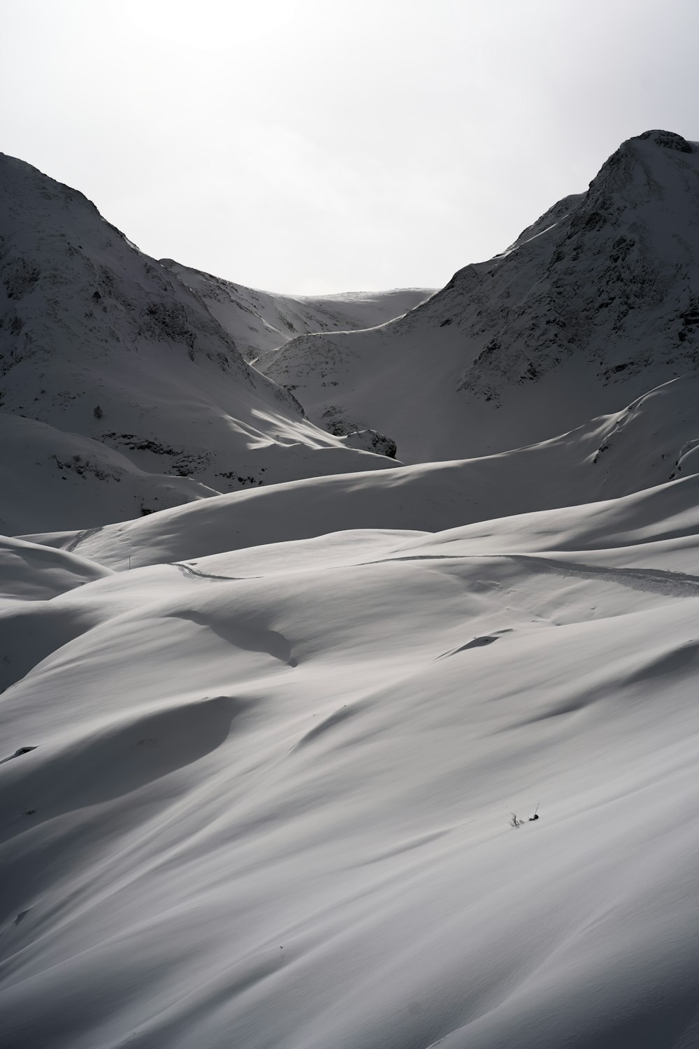 a person skiing down a snow covered mountain