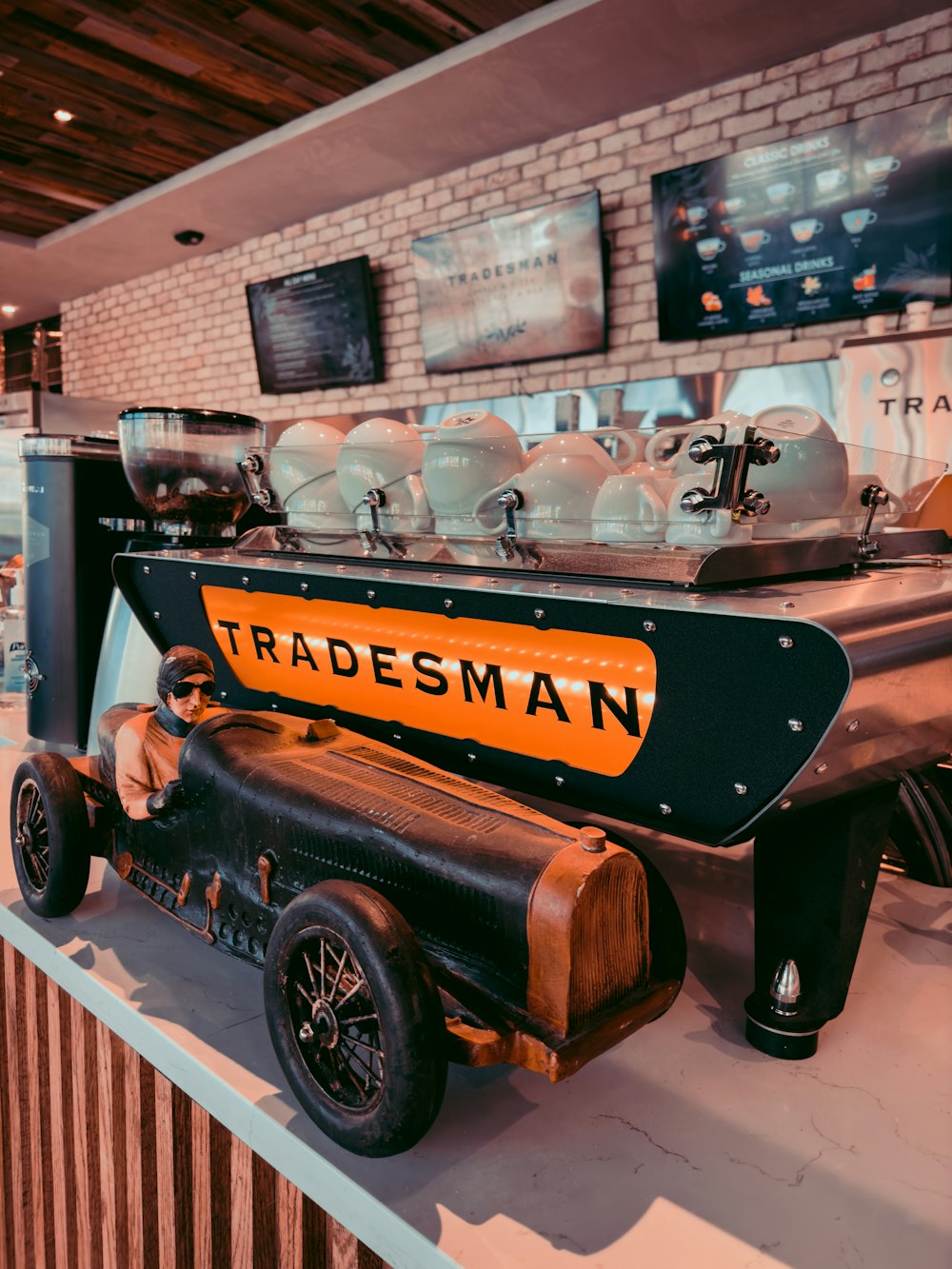 an antique race car is on display in a museum