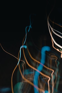 Abstract light trails created by stage lighting at a live music show