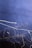 A dark blue background with streaks of white light forming abstract, swirling patterns. The dynamic lines appear to be created through long exposure photography, giving a sense of motion and fluidity.
